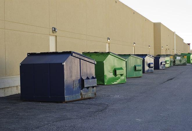 metal waste containers sit at a busy construction site in Columbus